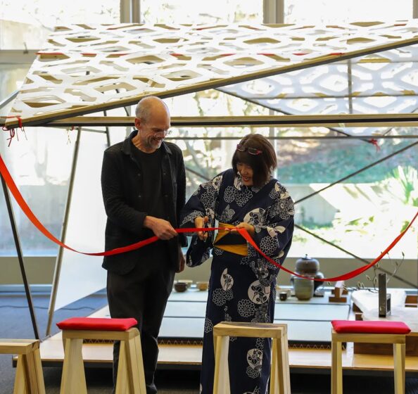 Professor David Matthews and 快活视频 Asian Festival Executive Director Kumi Alderman cut the ribbon on the mobile teahouse.